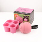 Poppy Pig Treat Dispenser dog toy next to product packaging and silicone mold tray