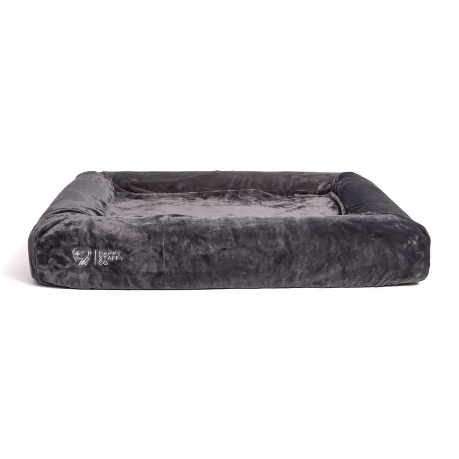 Dog bed with pullover blanket cover fully assembled on a white background