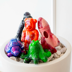 Close-up of Chewzilla® Galactic Quest dog toys including astronaut, rocket, octopus and bone